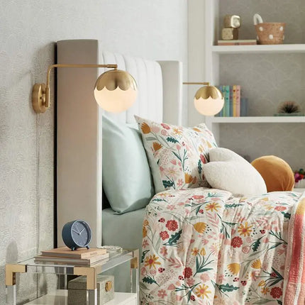 Camila 8 1/4" Brass and Glass Globe Plug-In Wall Lamp 360 Lightning