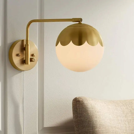 Camila 8 1/4" Brass and Glass Globe Plug-In Wall Lamp 360 Lightning